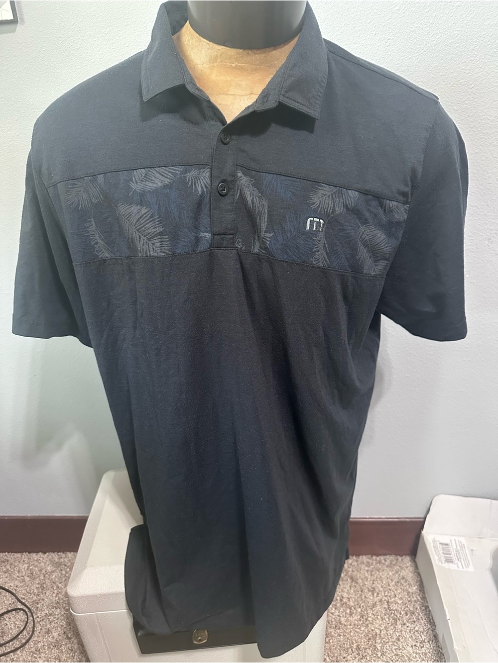 Travis Mathew Black Polo with Subtle Palm-Print Chest Panel
